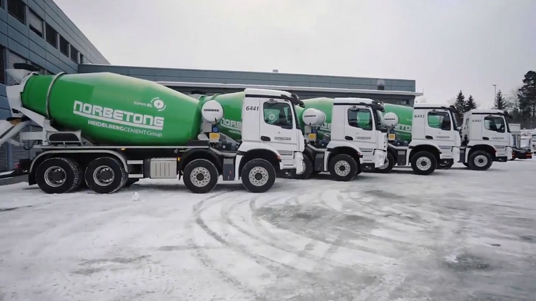The five mixer trucks can turn off their diesel engines when they arrive on-site