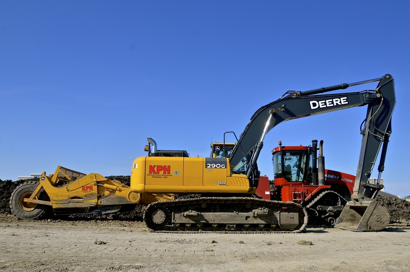 John Deere Hitachi manufacturing and marketing agreements excavators North Carolina Brazil British Columbia