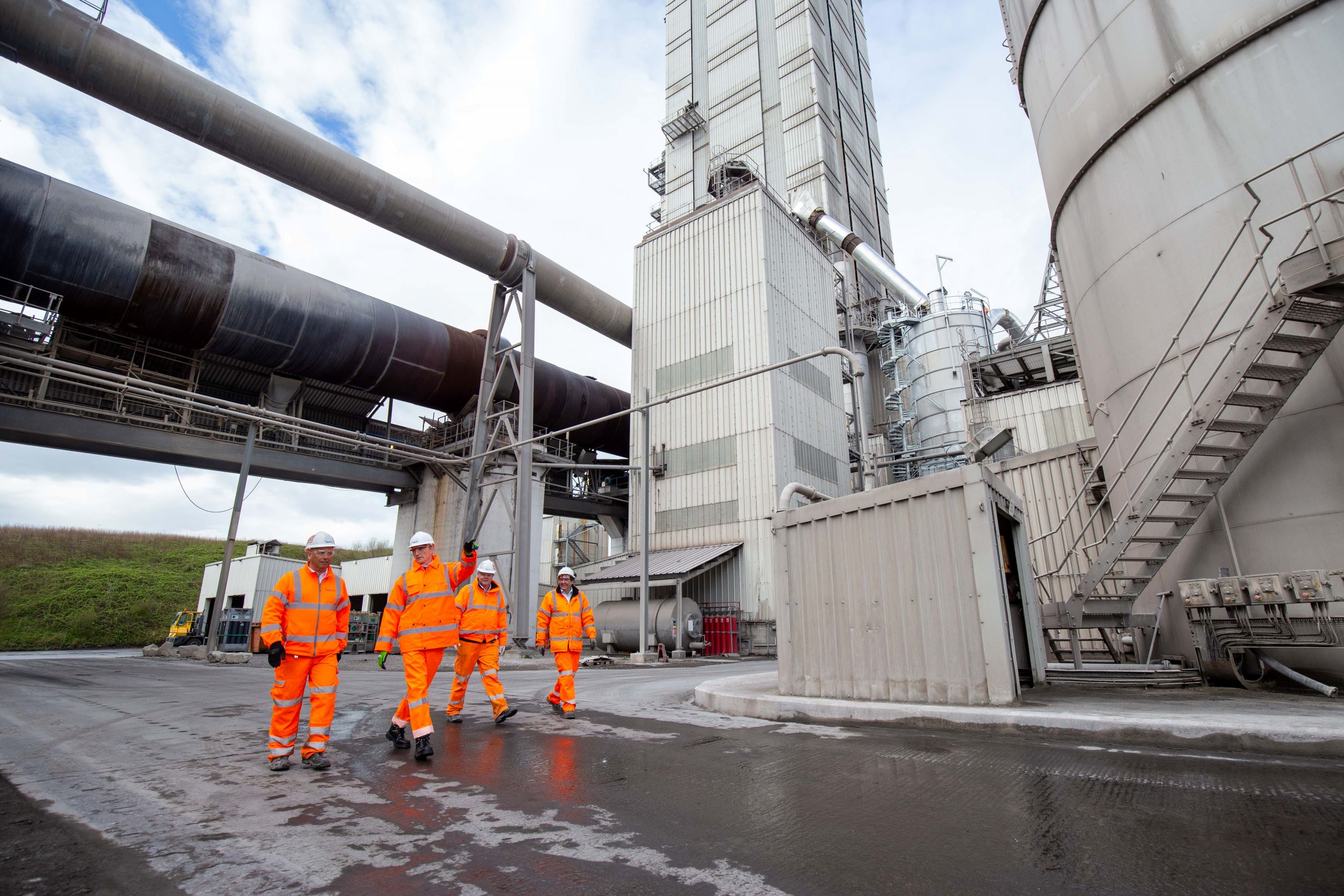 From left: Hanson UK CEO Simon Willis, David TC Davies MP, Minister for Wales, Padeswood cement works plant manager David Quick and Iain Walpole, Hanson’s head of process and sustainability – CCS, at Hanson’s Padeswood facility