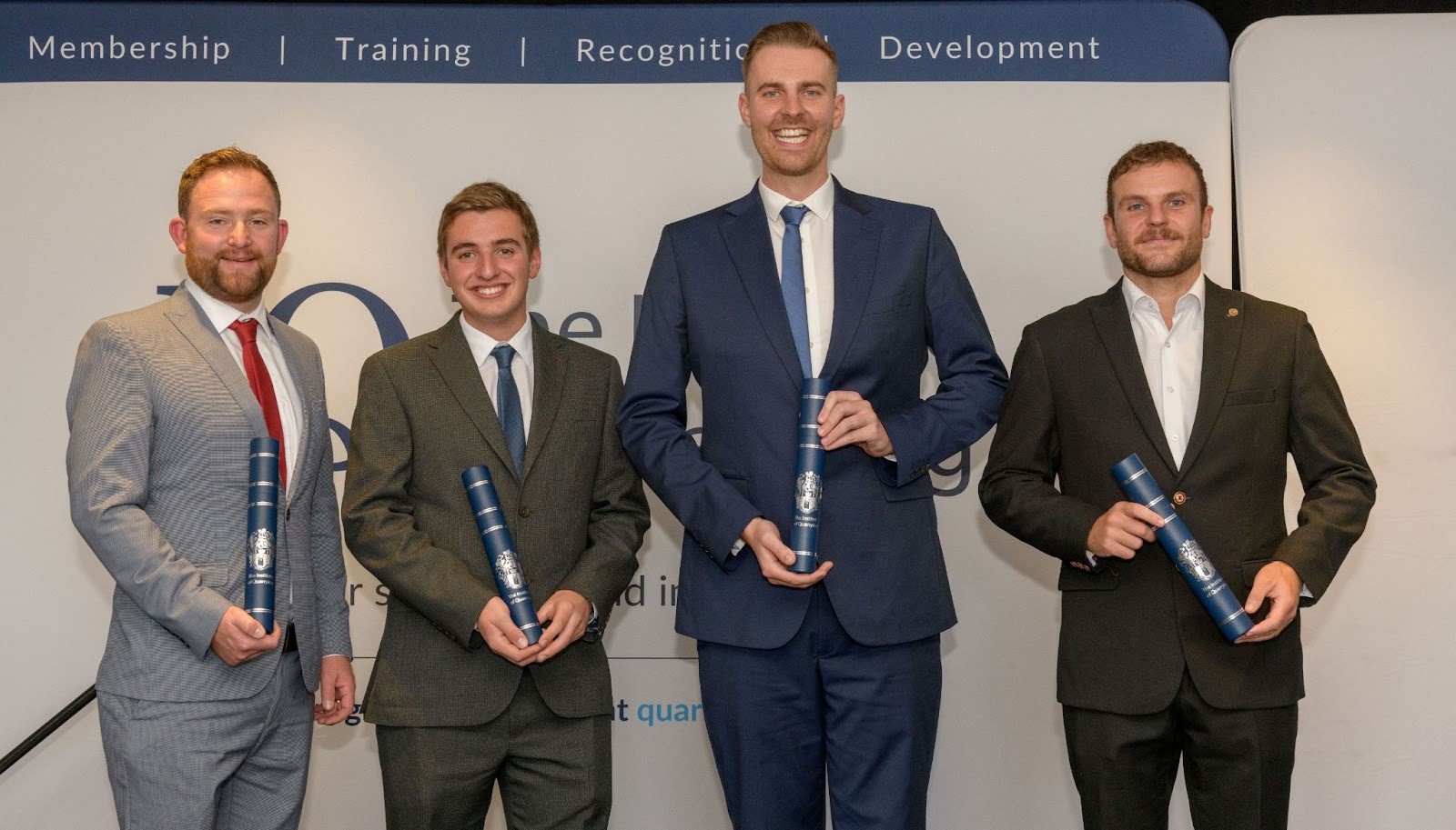 From left to right: Award winners Peter Triccas TMIQ, Ben Marsh, Oliver Kibble TMIQ, and Lewis Pinch TMIQ