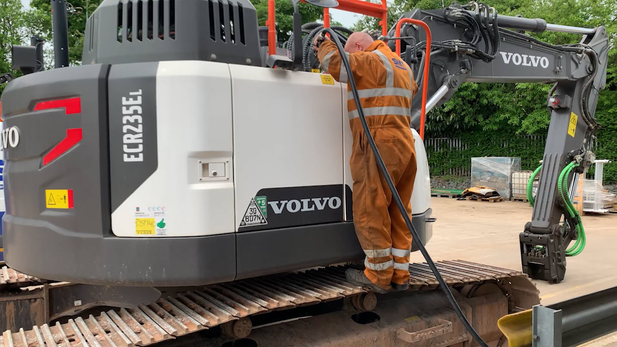An SMT GB technician refuels a Volvo ECR235E excavator with HVO fuel. Image: SMT GB