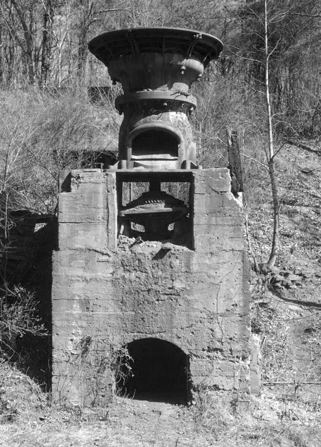 An early steam-driven single roll crusher