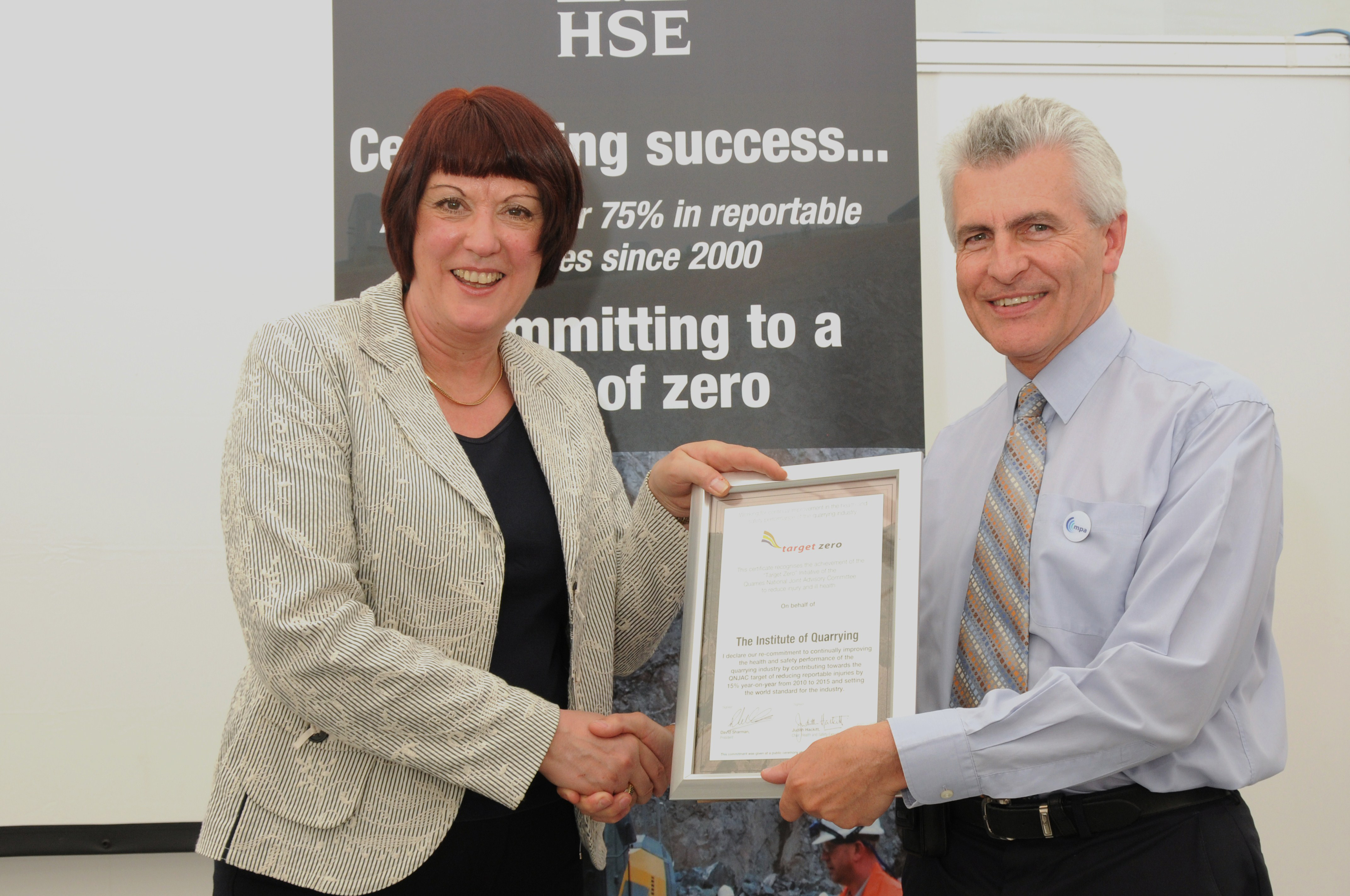 Martin Isles receives a signed "recommitment to Target Zero" certificate