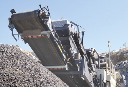 crusher by pile of aggregates