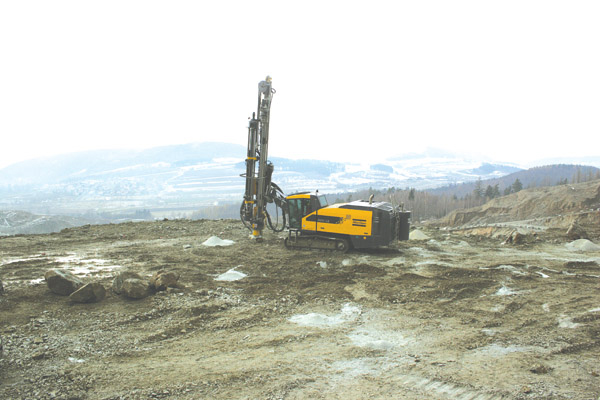 Atlas Copco drilling in to the ground