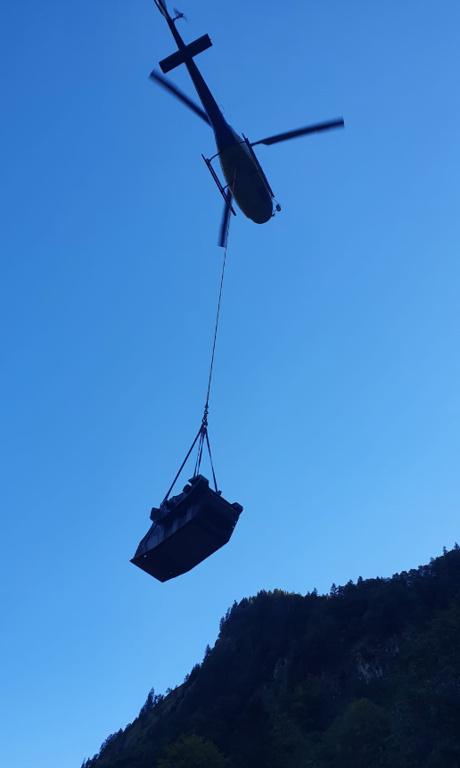 An MB Crusher BF60.1 MB mobile crusher is flown into position by helicopter in the Bavarian Alps