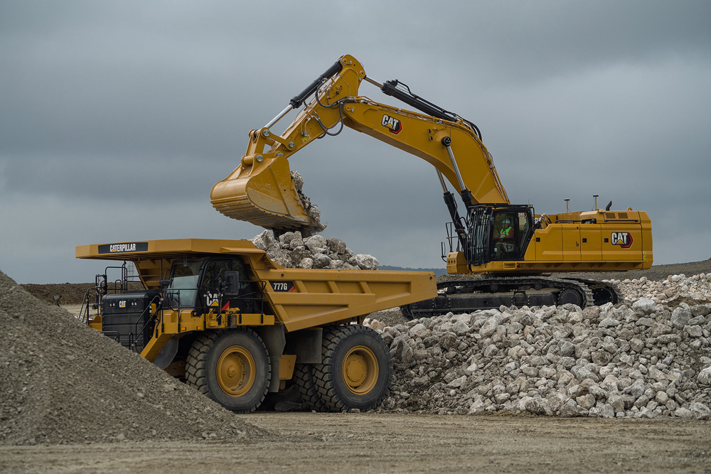 Remote Troubleshoot is available with a range of newer Cat quarrying-suited models, such as the January 2021-launched 352, 374 and 395 next-generation large excavators. Pictured is a Cat 395 large excavator loading a Cat 777G dump truck