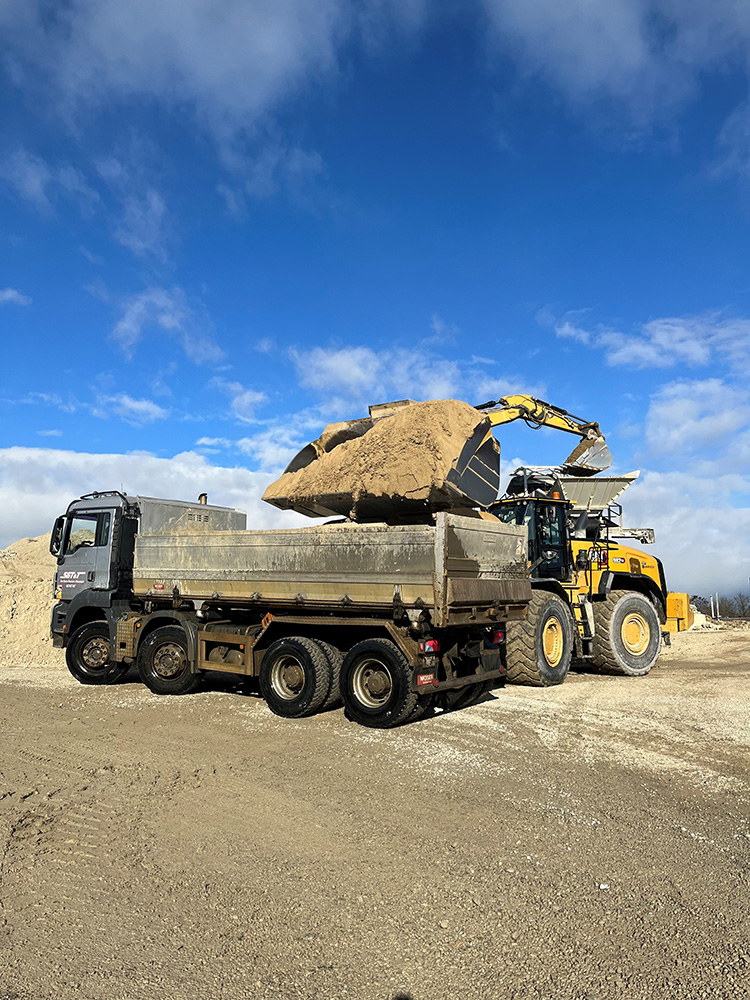 GESA’s Cat 982X E loads material onto a truck at Montfleury gravel pit near Geneva airport