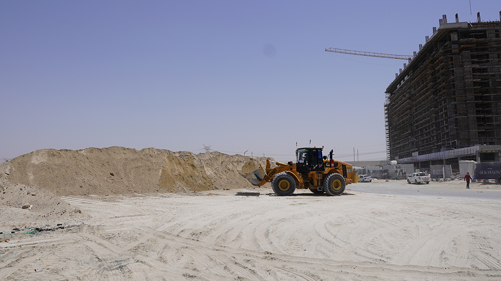 A Caterpillar wheeled loader getting ready to take sand to Azizi Developments’ Riviera 32 construction project site in Mohammed Bin Rashid City in Dubai