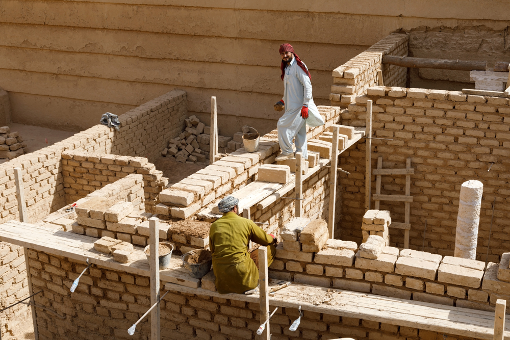 Construction workers during work at the fort near Raghbah, Saudi Arabia