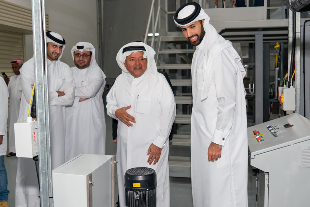 Sheikh Mohamed Bin Faisal Al Thani with his father and chairman of Aamal and Sheikh Faisal Bin Qassim Al Thani (centre) and other officials touring one of the industrial plants.