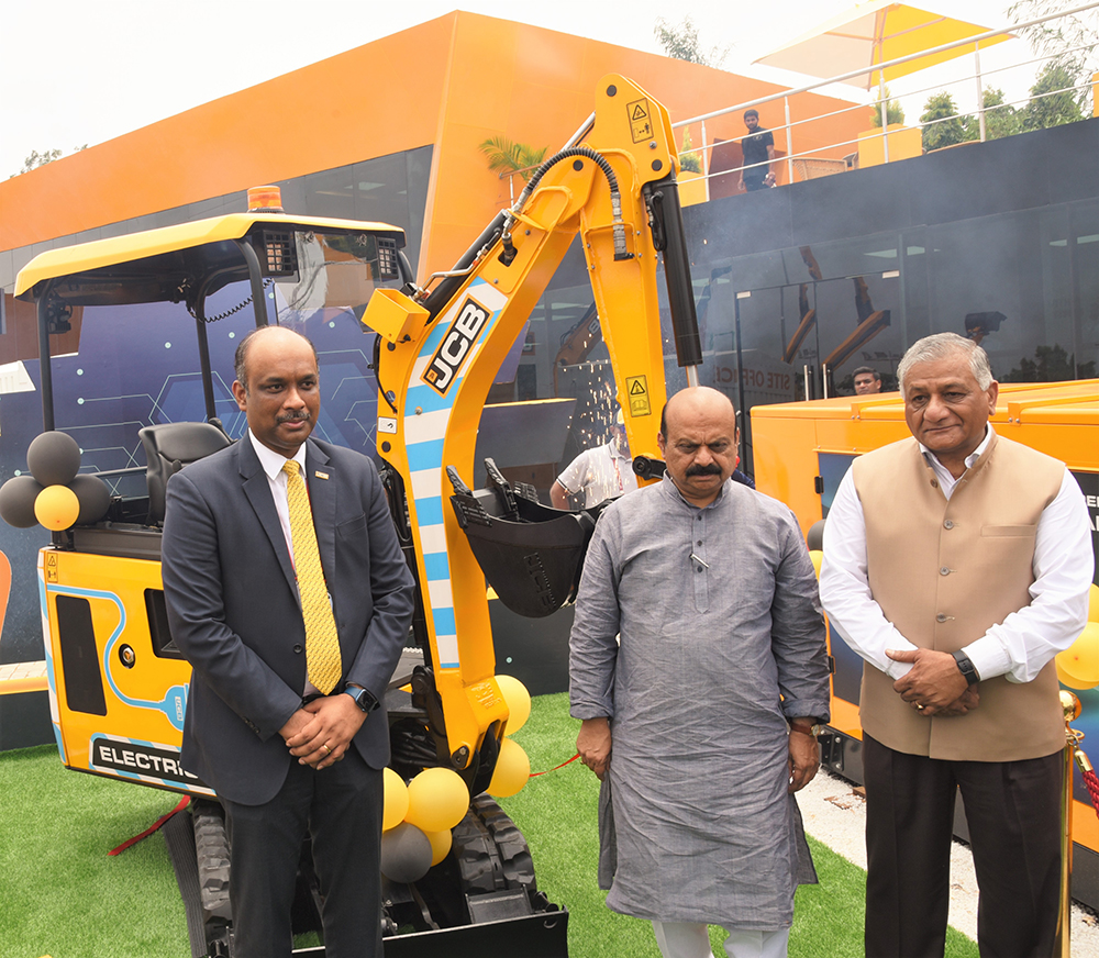 In front of a JCB electric mini excavator at Excon are from left: JCB India managing director; Deepak Shetty; chairman of CII Excon, Basavaraj Bommai, chief minister, Karnataka; and Dr. V.K. Singh, Indian Government Minister of State for Road Transport Highways & Civil Aviation