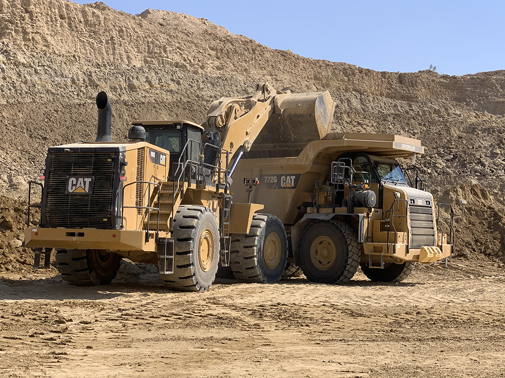 A new Cat 988K wheeled loader and new Cat 772G rigid dump truck at work at Dali quarry