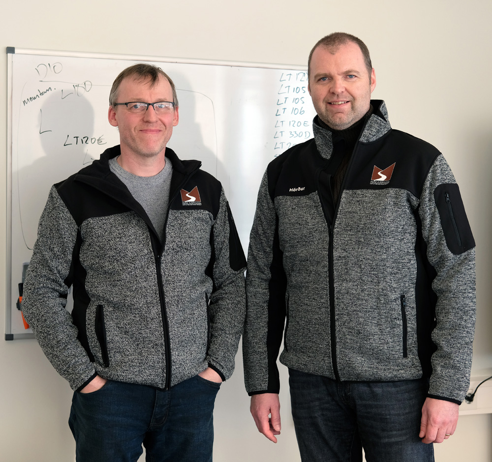 Hörður Pétursson, the managing director of the operation of Steypustöðin (right), and Sigurdur Sigursson, servicing manager, with a list of their twenty Metso Outotec products behind them