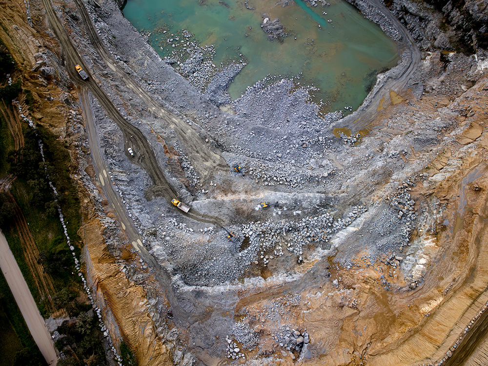 An aerial view of haulers at work at Herdade de Benafessim quarry. Pic: Metso