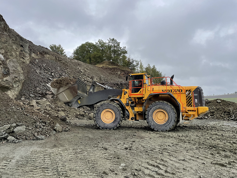A Volvo CE L350H wheeled loader being used to move hard volcanic rock at a quarry operated by Schicker Hartsteinwerke in Bavaria