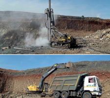 Atlas Copco surface rock drill and Volvo excavator 