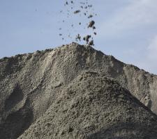 A manufactured sand stockpile at an Asian aggregates materials processing site.jpg