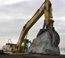 Shifting aggregate for use in coastal defenses in Wales