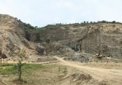 Volvo excavators in the Alam Jaya volcanic rock quarry 