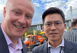 Doosan Infracore Europe CEO Chris Jeong with Aggregates Business editor Guy Woodford at bauma 2022 in Munich, Germany