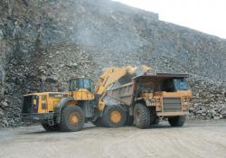 Baslt rock emptied in to truck at quarry site 