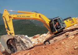 excavator shifting marble on a steep slope