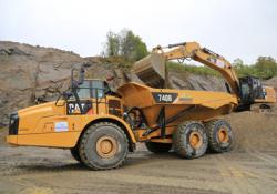 A Breedon Cat 740B being loaded by a Cat 336E hybrid