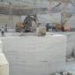 Volvo excavator being used by JK Natural Mables to push a large marble block away from the bench650.jpg